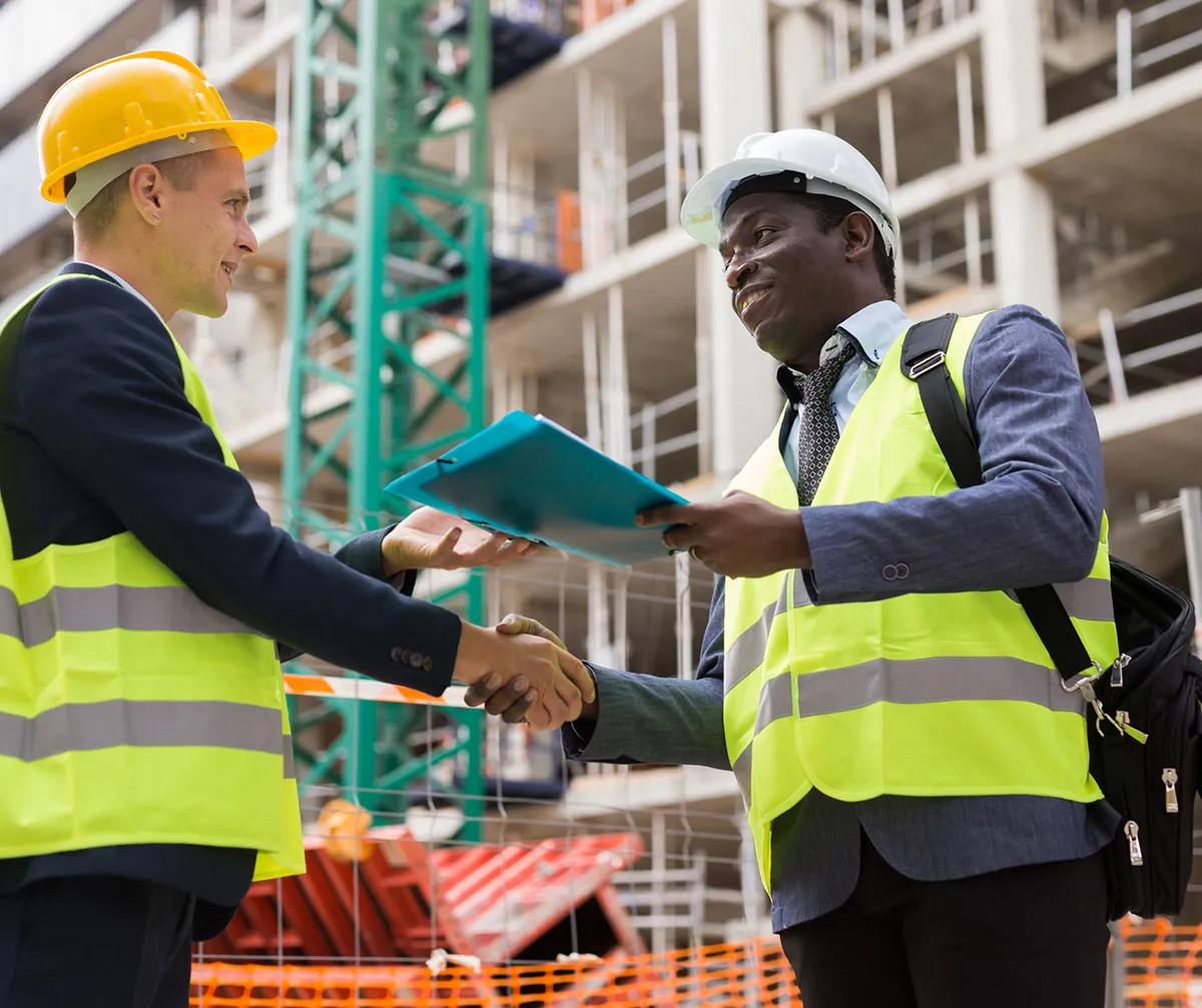 construction workers shaking hands